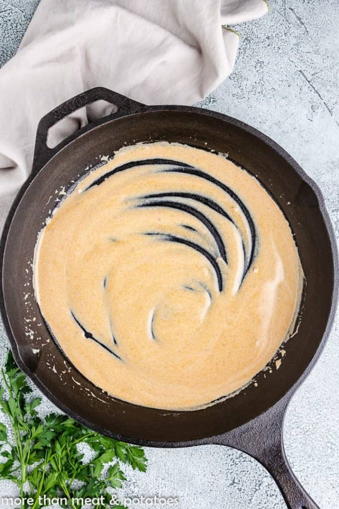 The sour cream gravy mixed in the pan.