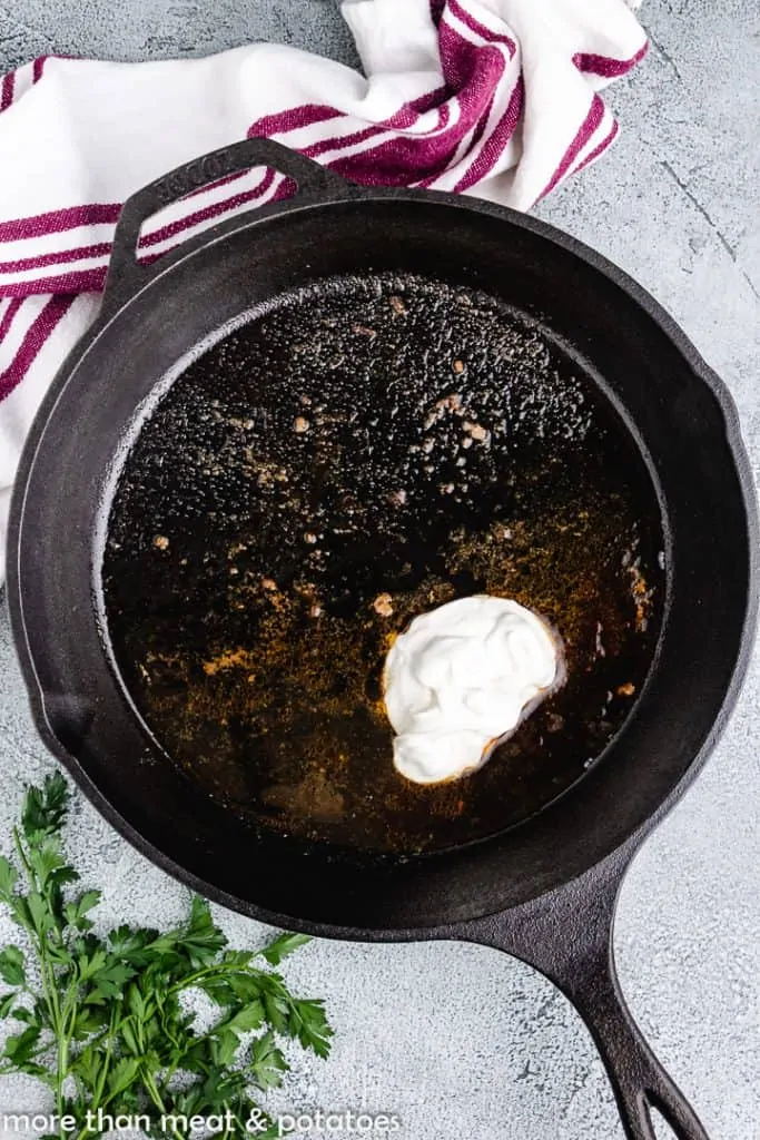 Worcestershire sauce and other ingredients added to the skillet.