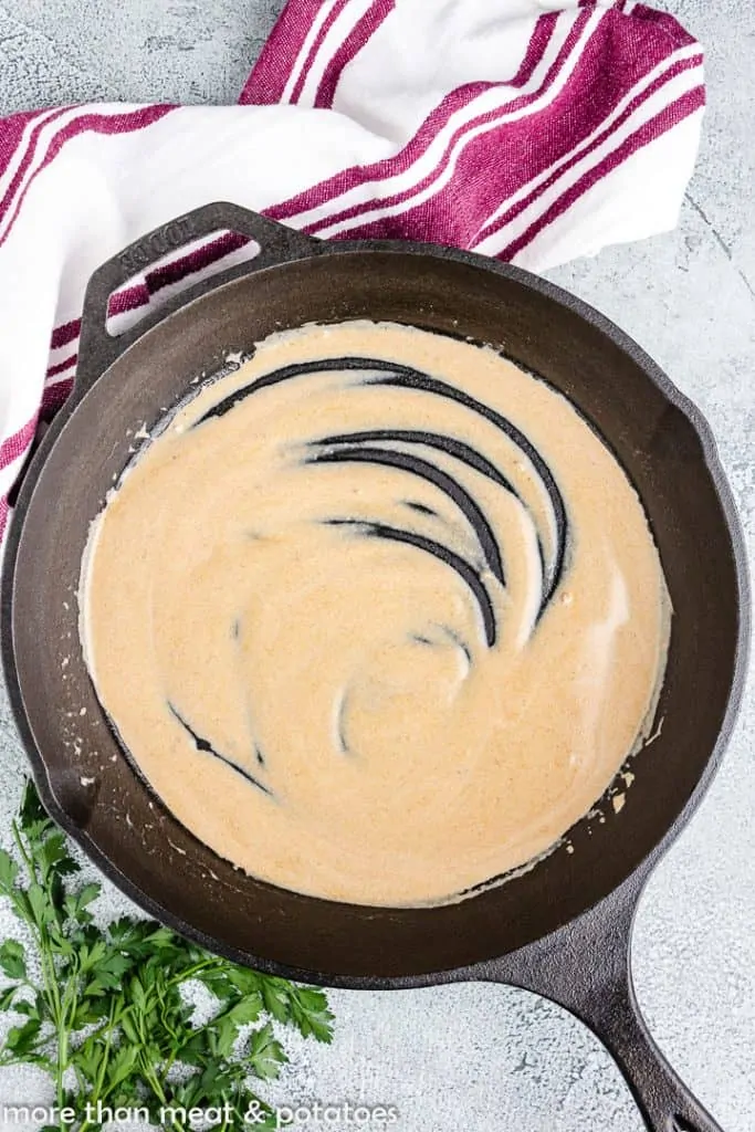 The finished gravy in the cast iron skillet.