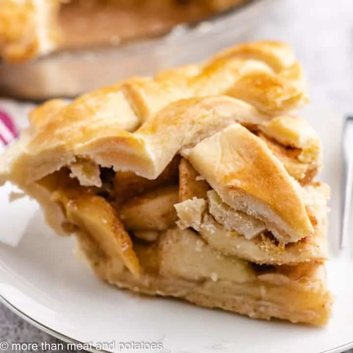 The finished southern apple pie served on a plate.