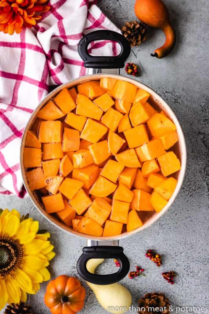 Sweet Potato Casserole with Pecan Streusel Cubed sweet potatoes in a pot of water.