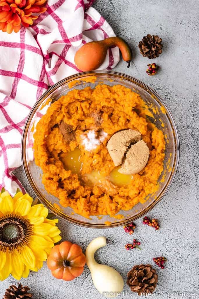 Sweet Potato Casserole with Pecan Streusel Mashed sweet potatoes and spices in a bowl.