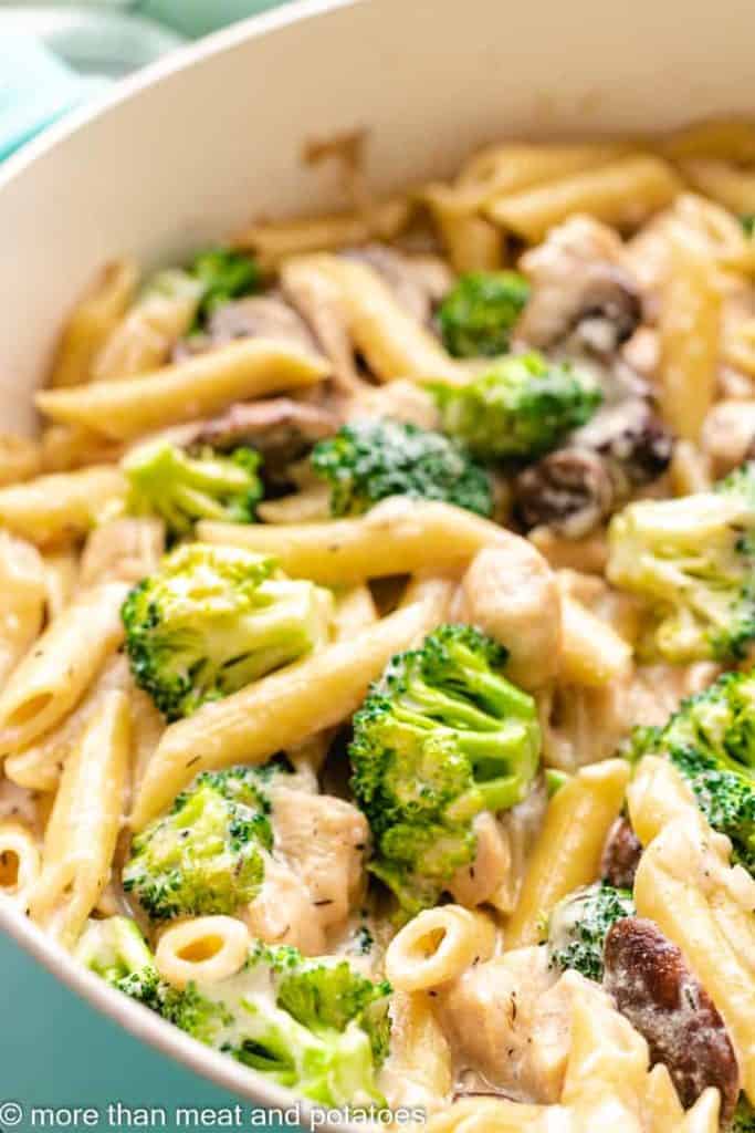 An up-close view of the chicken mushroom broccoli pasta in the skillet.