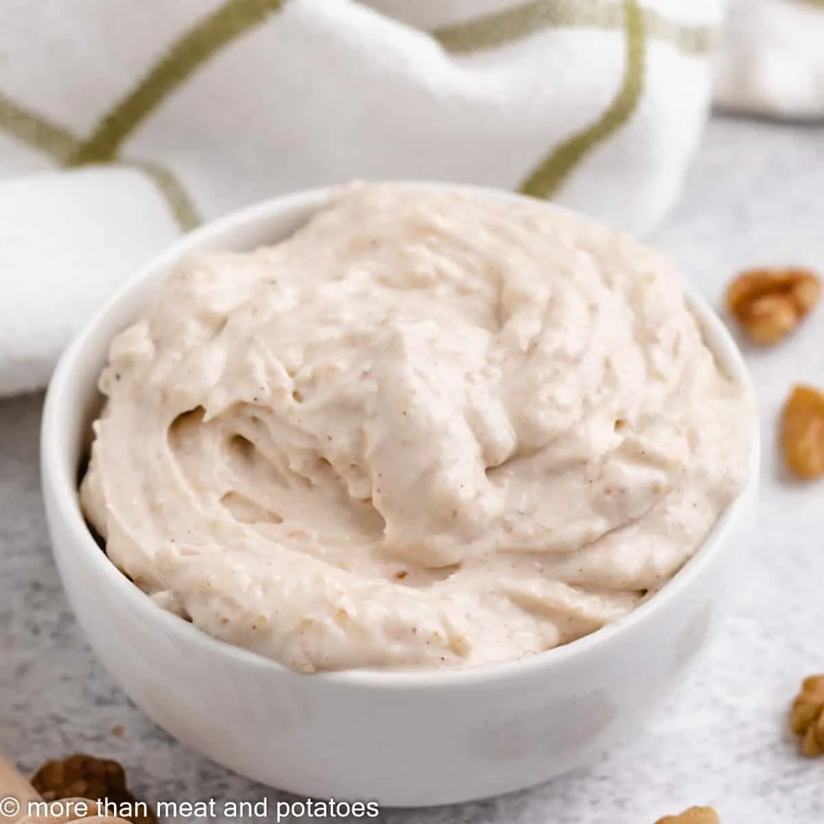 The finished honey walnut cream cheese in a bowl.