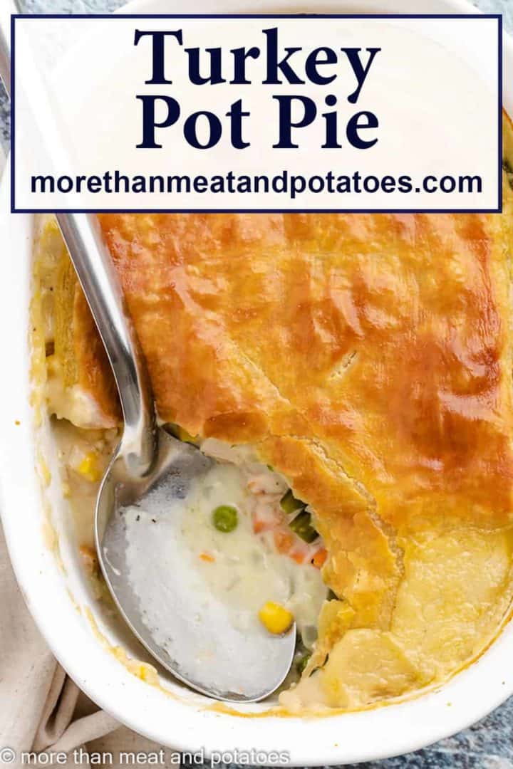 A serving of turkey pot pie with puff pastry removed from the dish.