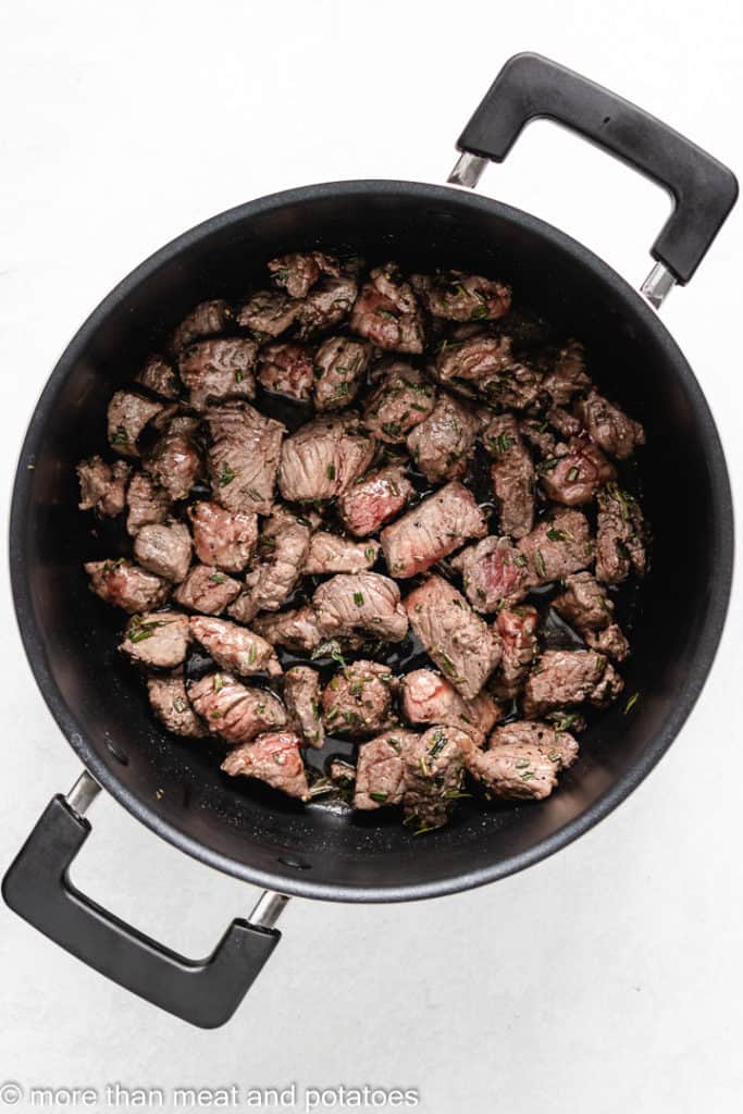 Stew meat searing in a hot stock pot.