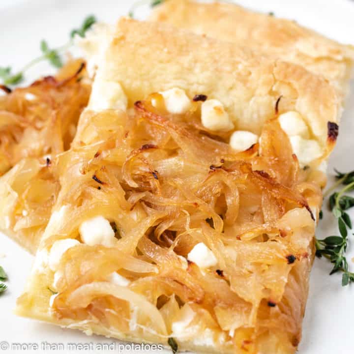 Slices of onion tart on a plate.