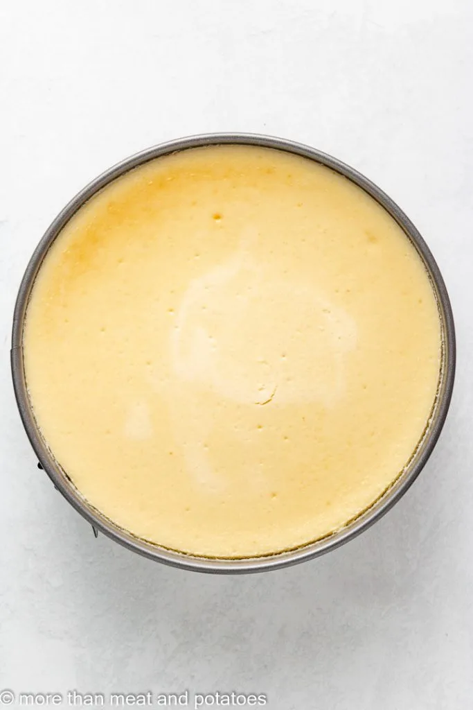 Top down view of cooked cheesecake.