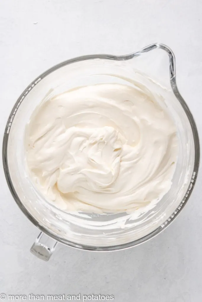 Cheesecake filling in a glass bowl.