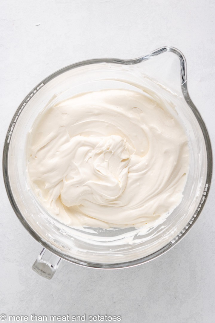 Cheesecake filling in a glass bowl.