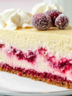 Side view of a slice of cheesecake.