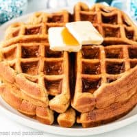 Eggnog waffles topped with butter and pure maple syrup.