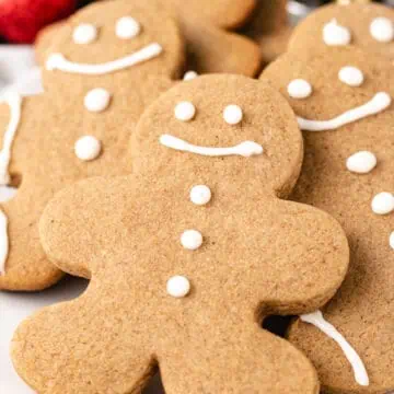 Decorated christmas cookies on a plate.