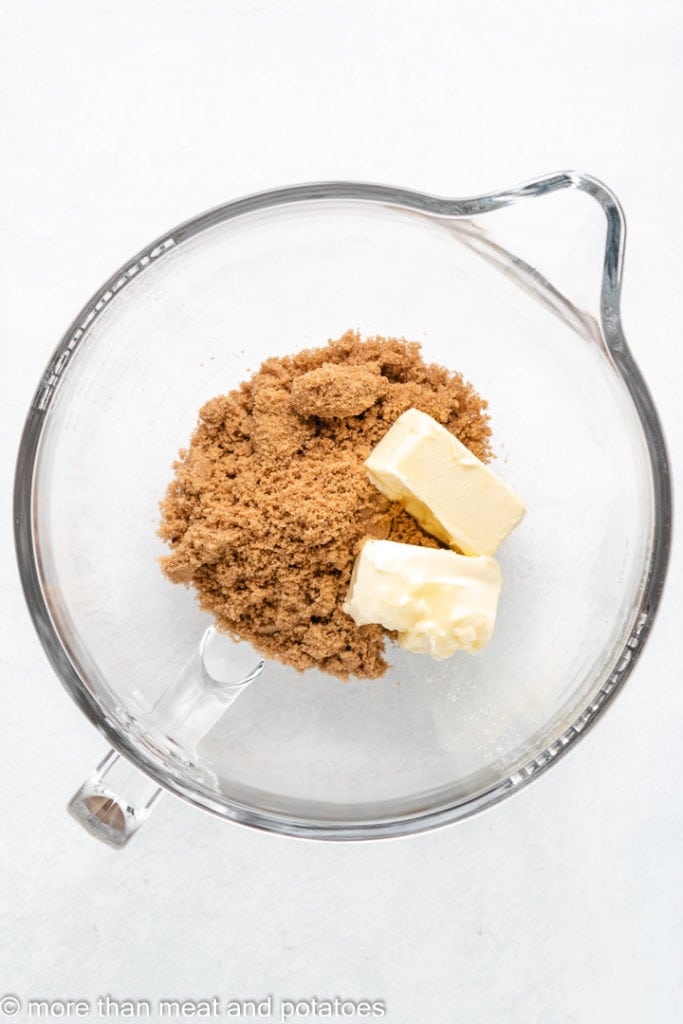 Brown sugar and butter in a stand mixing bowl.