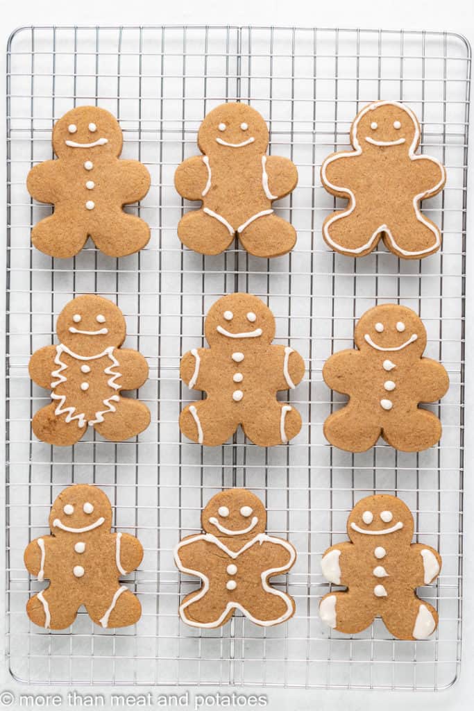 Baked and cooled cookies decorated on a wire rack.