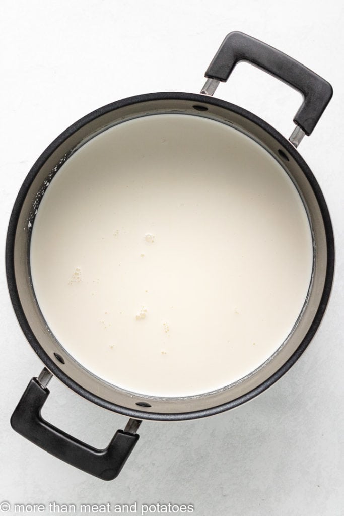Milk, heavy cream, and other ingredients in a saucepan.