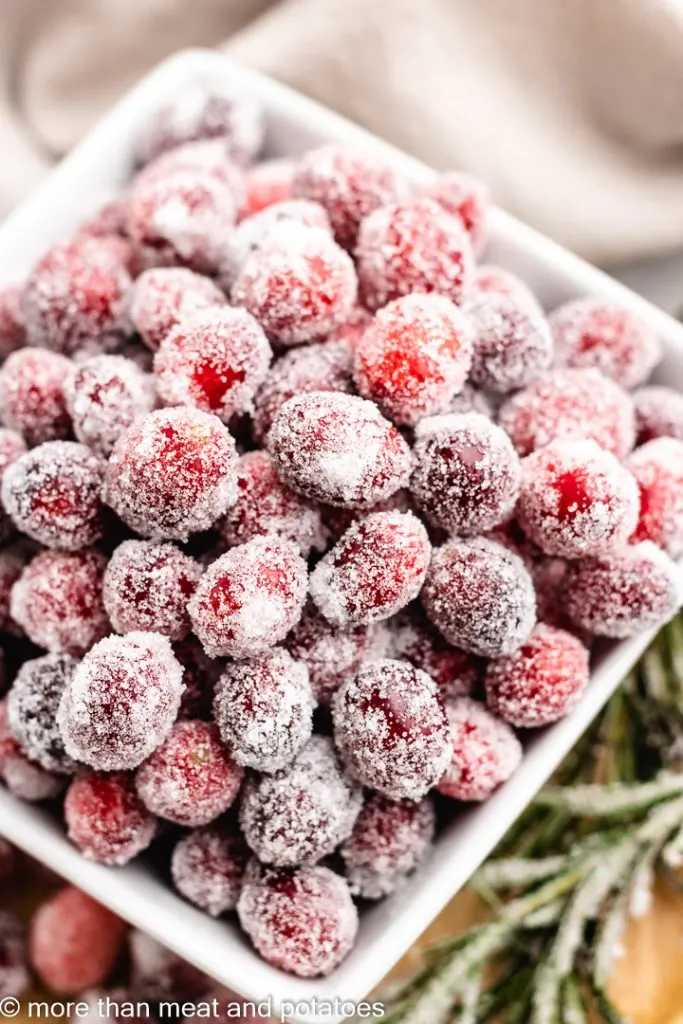 A close-up of the candied berries in a square bowl.