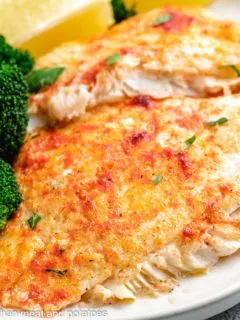 Baked flounder topped with smoked paprika and fresh parsley.
