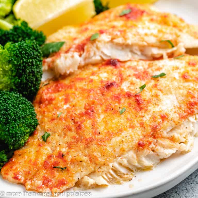 Baked flounder topped with smoked paprika and fresh parsley.