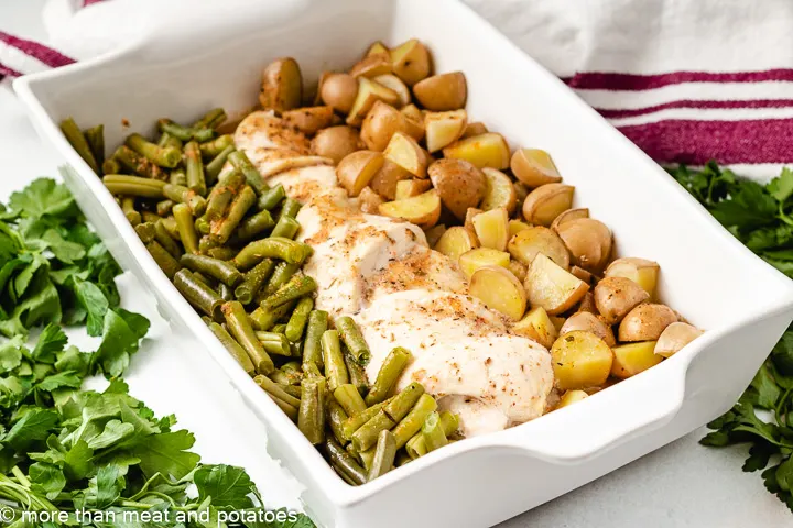 Chicken and green bean dinner in a pan.