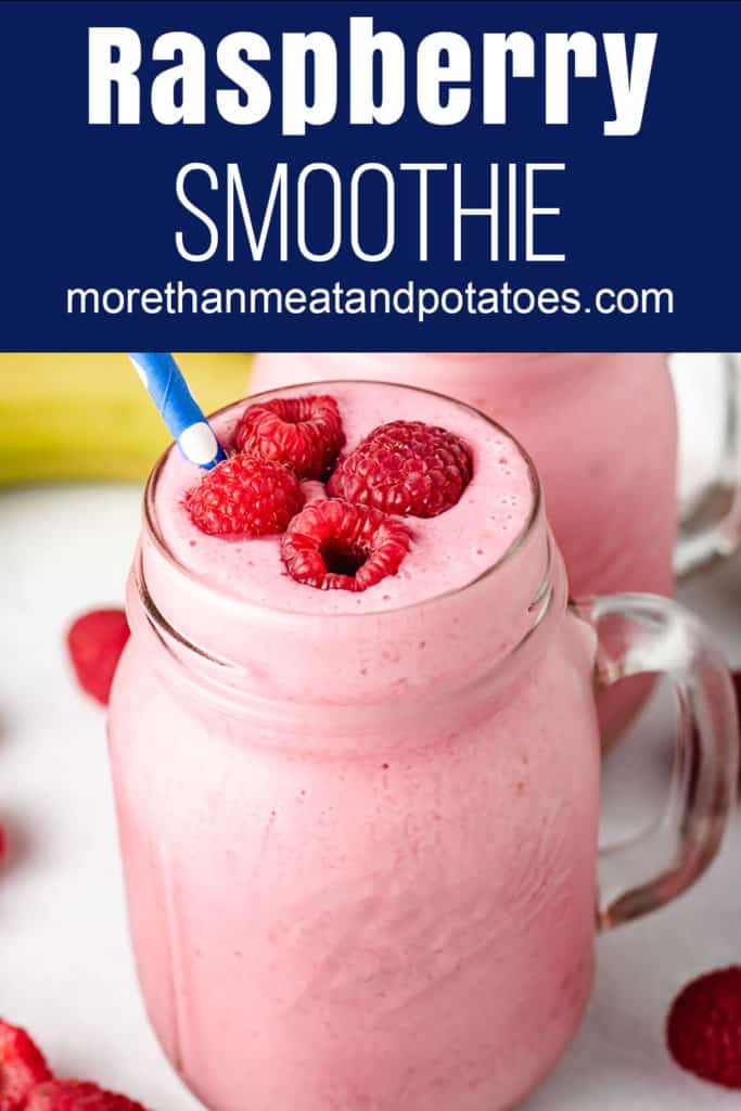 Smoothie in a glass jar topped with fresh raspberries.