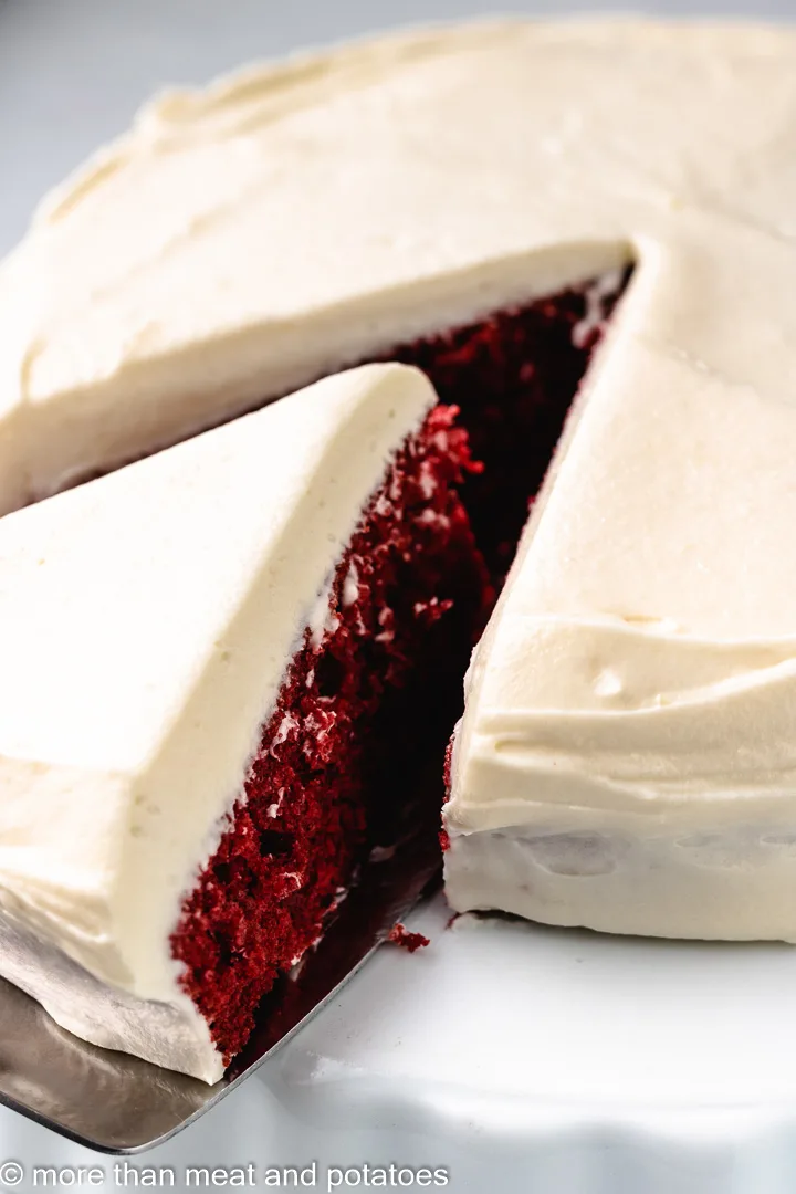 Red velvet cake on a metal spatula.