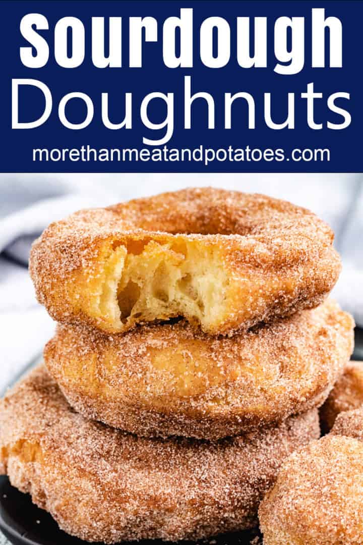 Stack of sourdough doughnuts with a a bite taken out.