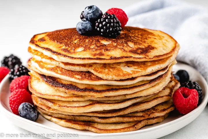 Sourdough starter pancakes on a white plate.