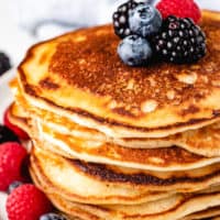 Stack of sourdough pancakes with blueberries.