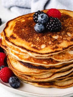 Sourdough Starter Pancakes topped with fresh fruit.