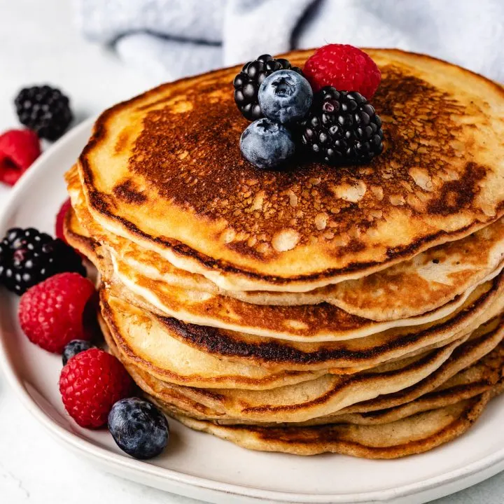 Sourdough starter pancakes topped with fresh fruit.