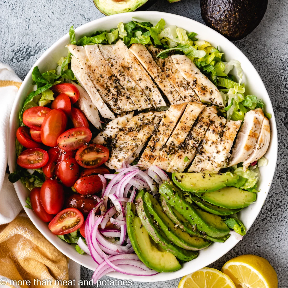 Top down view of chicken avocado salad on a dish.