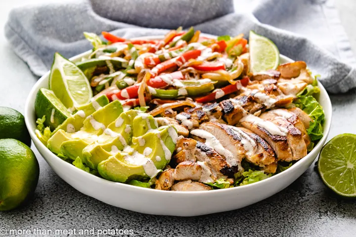 Chicken fajita salad with fresh avocados.