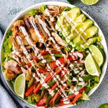 Chicken fajita salad in a gray serving dish.