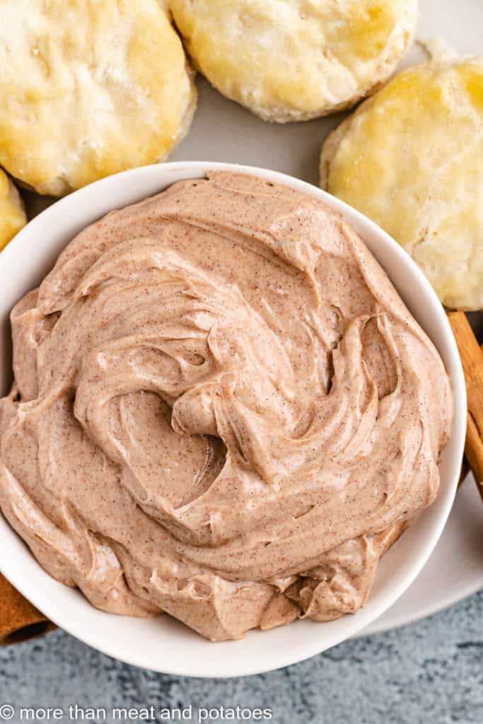 Top down view of cinnamon butter and biscuits.