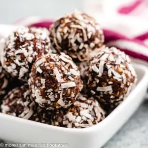 Date balls in a square white bowl.