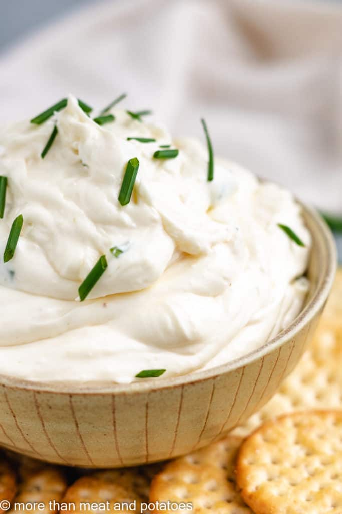 Garlic dip in a yellow bowl.