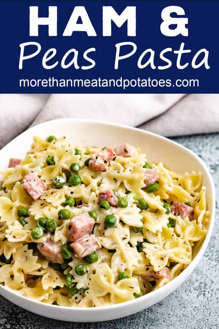 Ham and peas pasta in a white bowl.