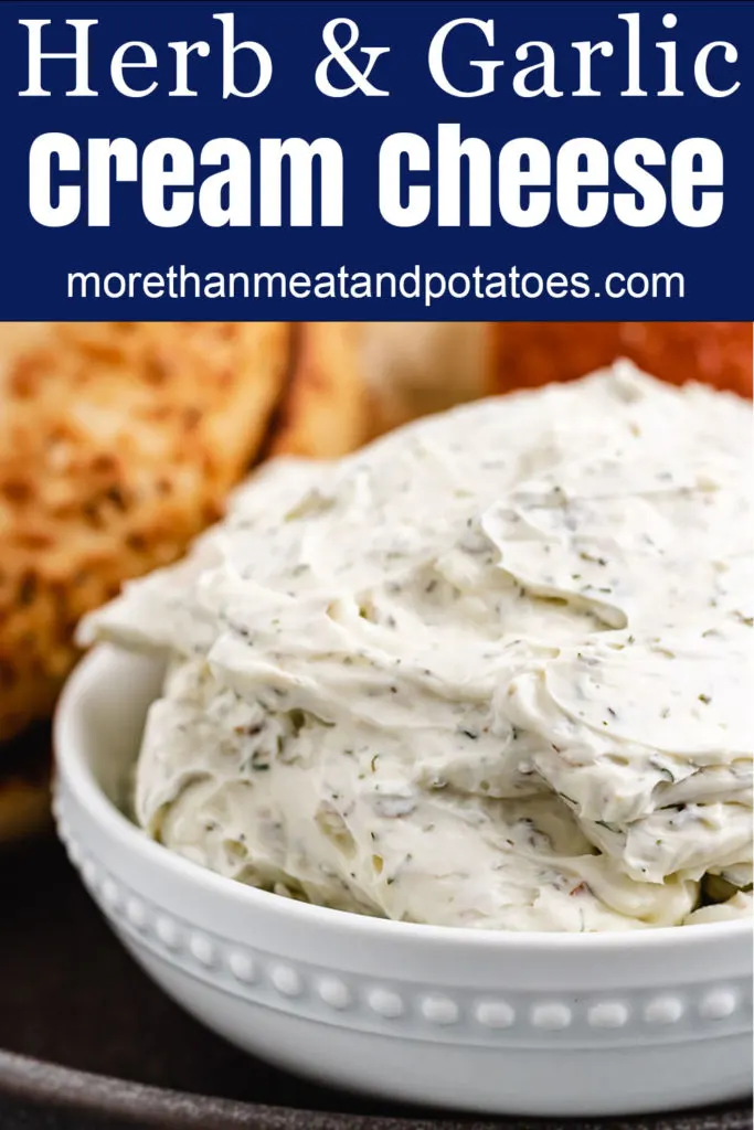 Herb and garlic cream cheese in a white bowl.