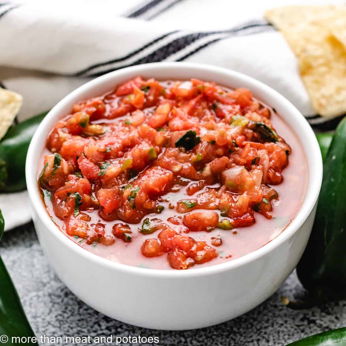 Fresh tomato salsa in a white bowl.