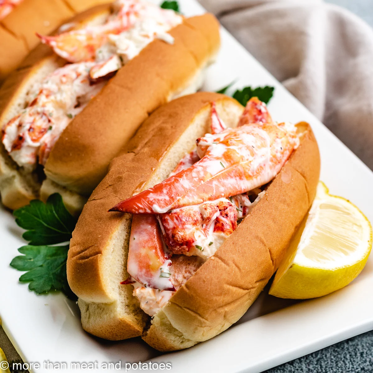 Lobster rolls tossed in mayonnaise.