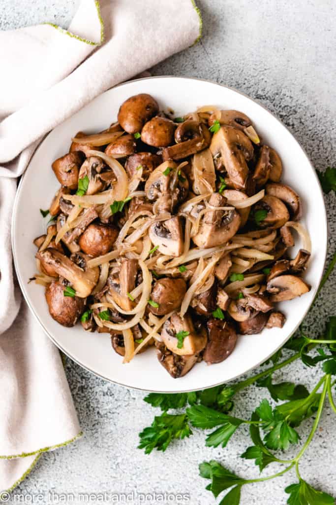 Bowl of sautéed mushrooms and onions.