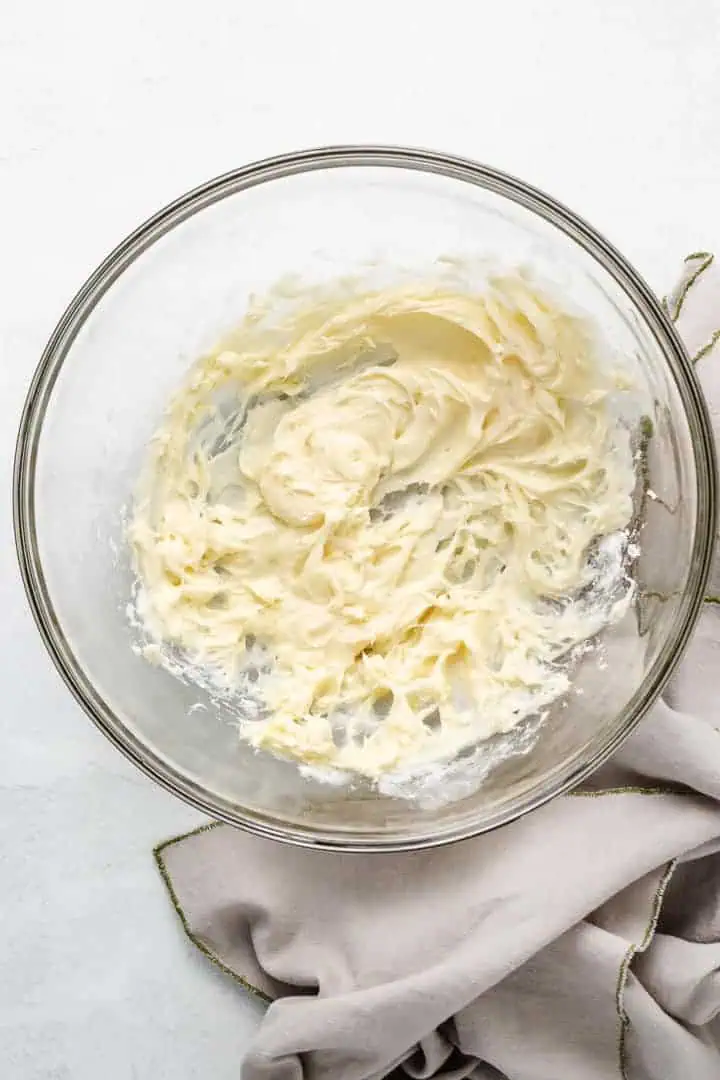 Cream cheese frosting in a bowl.