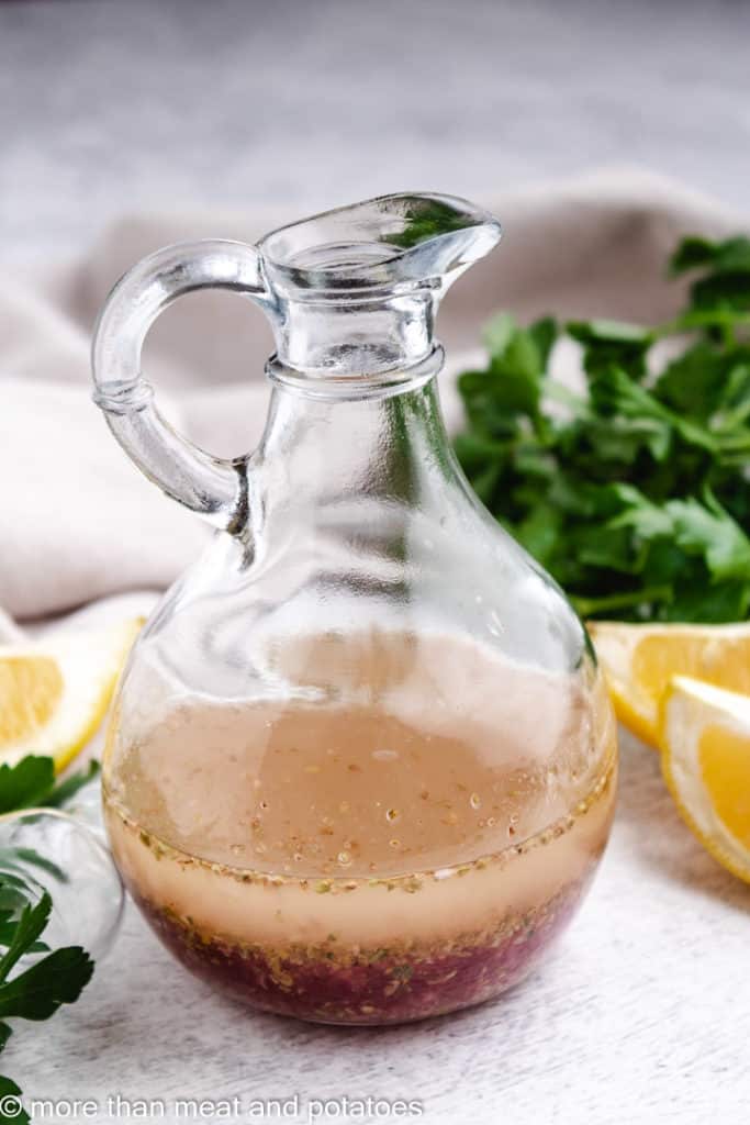 Salad dressing in a glass container.