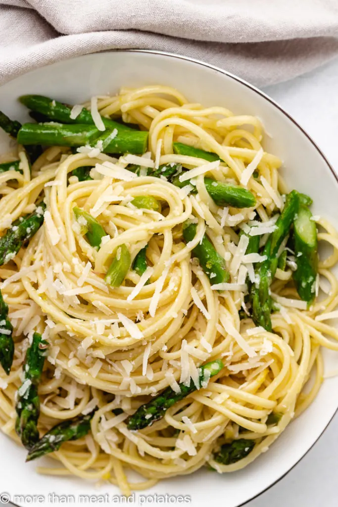 Top down view of lemon linguine in a white serving bowl.