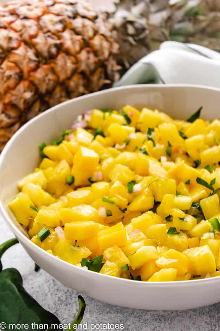 Mango pineapple salsa in a gray dish.