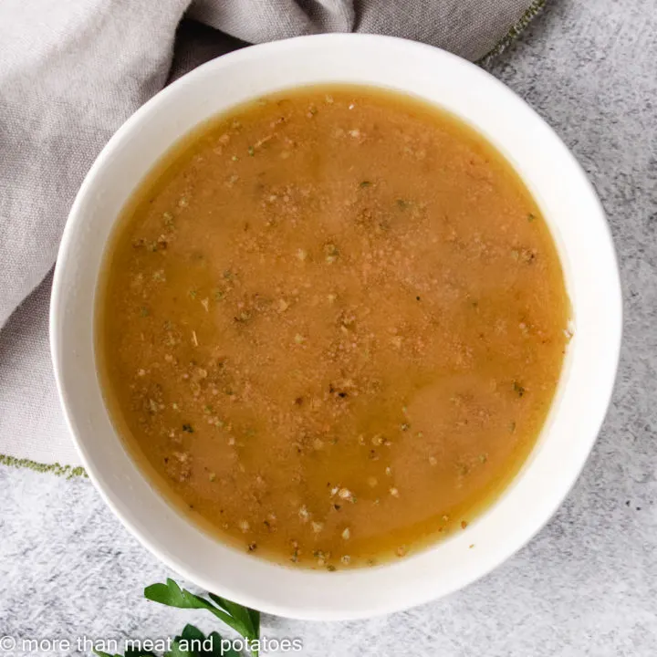 Close up of red wine vinaigrette in a small dish.