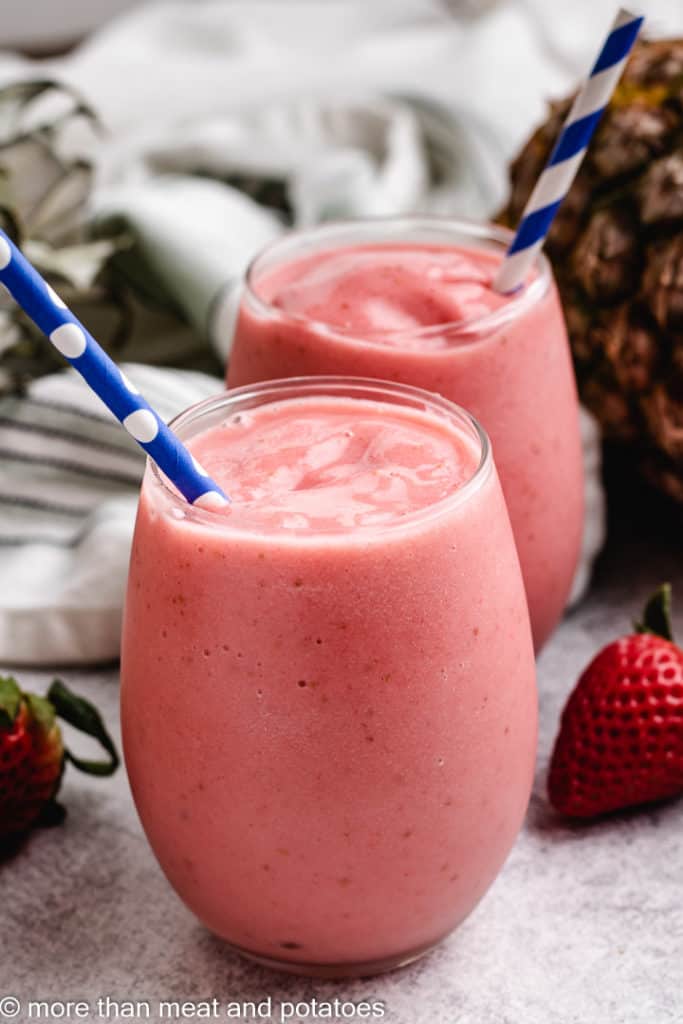 Two glasses of strawberry and pineapple smoothie.