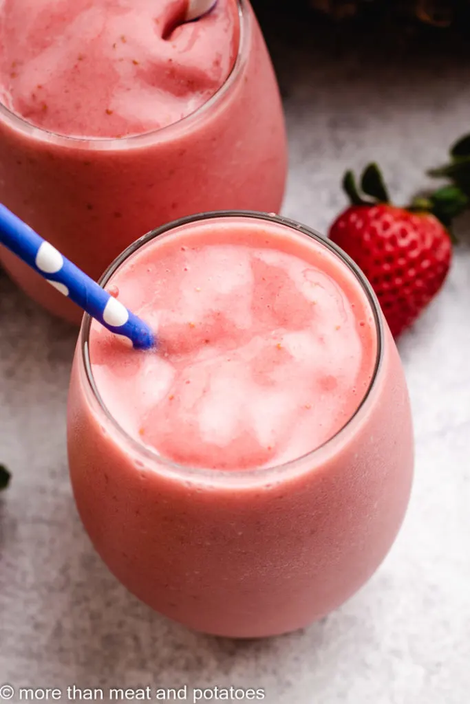 Top down view of a strawberry pineapple smoothie.