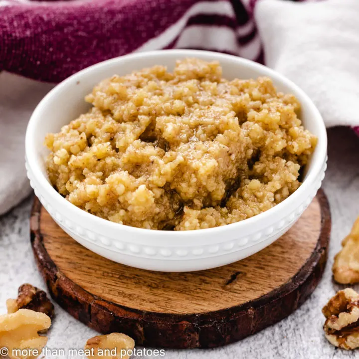 Fresh walnut pesto in a small white dish.